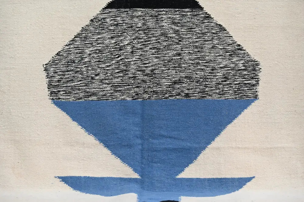 DecorBites handmade traditional azilal rug in black gray and blue geometric design showcasing Moroccan craftsmanship on off-white