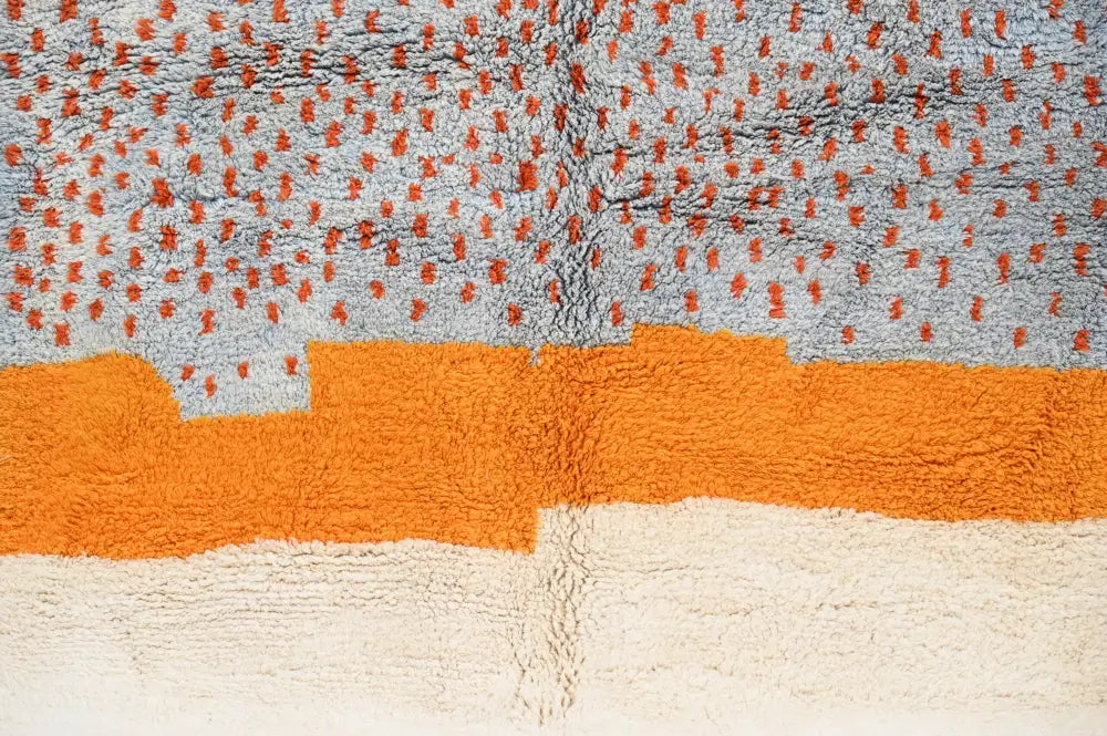 DecorBites™ handmade moroccan azilal rug 304 x 210 cm with a gray field dotted in orange and bold orange and white bands