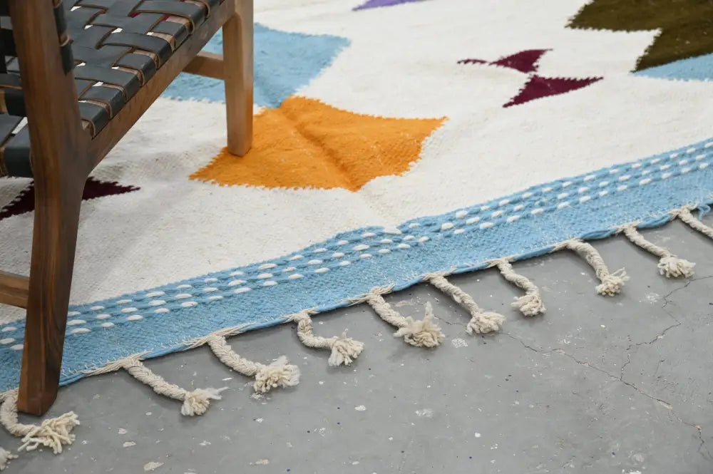 DecorBites™ handmade Moroccan azilal rug 305x204cm with vibrant geometric patterns and cream-colored fringe