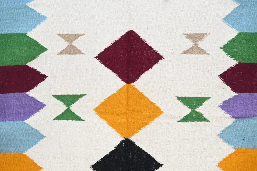 DecorBites™ handmade Moroccan azilal rug 305x204cm with vibrant geometric patterns in maroon, orange, green, and blue