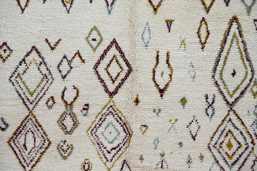 Cream-colored handmade moroccan azilal rug with intricate burgundy, olive green, and beige geometric patterns 305x206cm