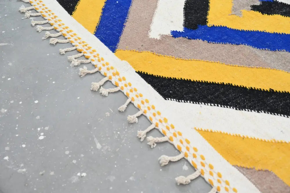 Vibrant handmade moroccan azilal rug with bold yellow blue black beige stripes and white fringe with mustard dots 306x196cm