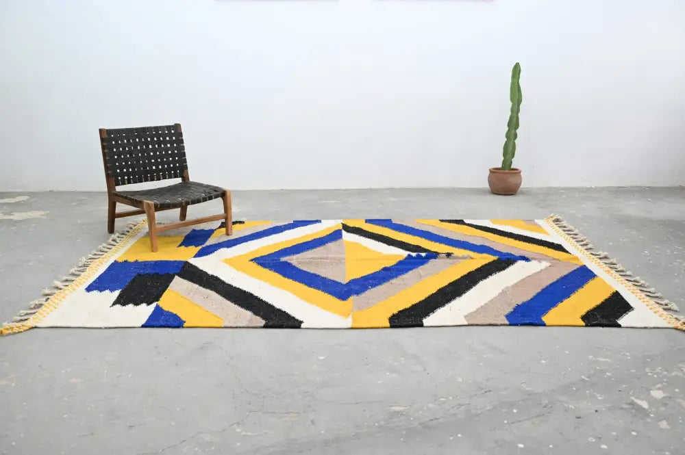 Vibrant handmade moroccan azilal rug with bold blue yellow black and beige stripes on white base 306x196cm