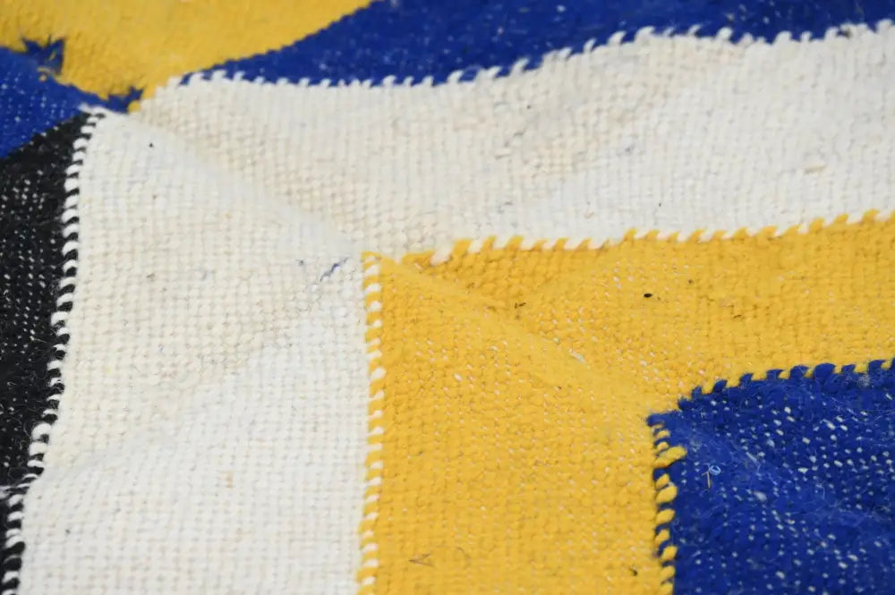 Decorbites handmade moroccan azilal rug with bold yellow blue and white geometric patterns 306x196cm