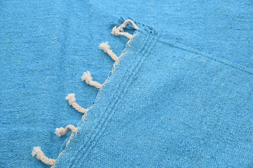 Bright blue woven decorbites™ handmade moroccan azilal rug 306x200cm with cream-colored tassels along the edge