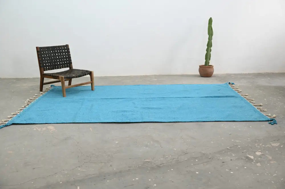 Bright turquoise woven decorbites handmade moroccan azilal rug 306x200cm with fringed edges and intricate texture