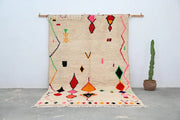 Beige handmade moroccan azilal rug with vibrant red orange green pink and black geometric patterns 309x195cm by DecorBites