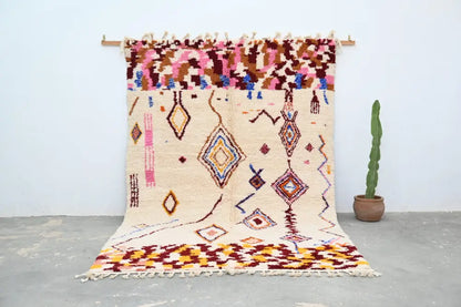 Beige moroccan azilal rug handmade by decorbites with colorful geometric patterns and fringed edges 309x207cm