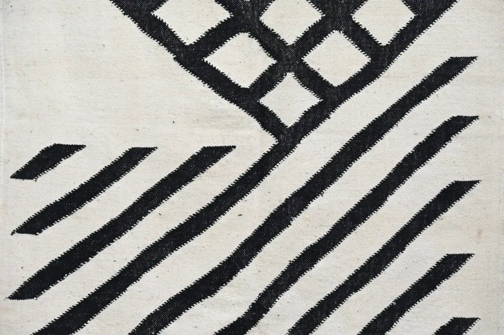 Black and white geometric patterned woven textile of decorbites handmade moroccan azilal rug 317x200 cm