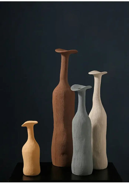 Set of four DecorBites handmade nordic ceramic flower vases with earthy tones textured surfaces and flared tops