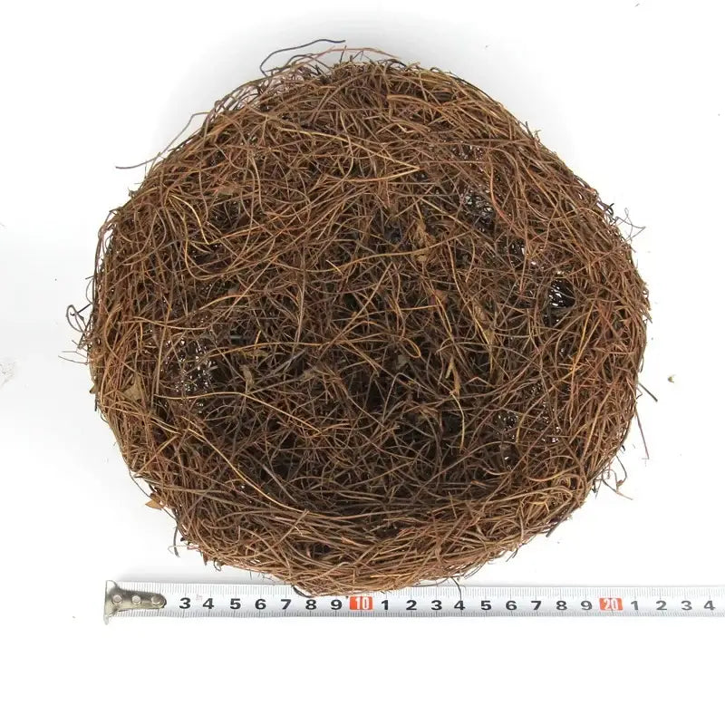 Brown circular coconut coir ball with textured fibrous surface for decorbites handmade round rattan bird nest decoration