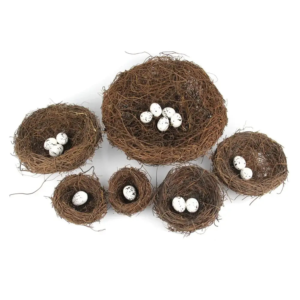 Set of six rustic brown handmade rattan bird nests with white speckled eggs for decoration by DecorBites