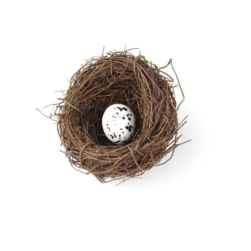 Decorbites™ handmade round rattan bird nest decoration with a white egg with black speckles in a brown woven rattan bird nest