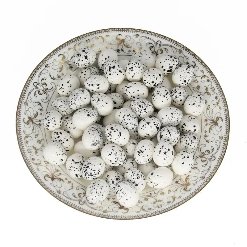 Decorbites™ handmade round rattan bird nest decoration with white speckled egg-shaped candies in a porcelain bowl