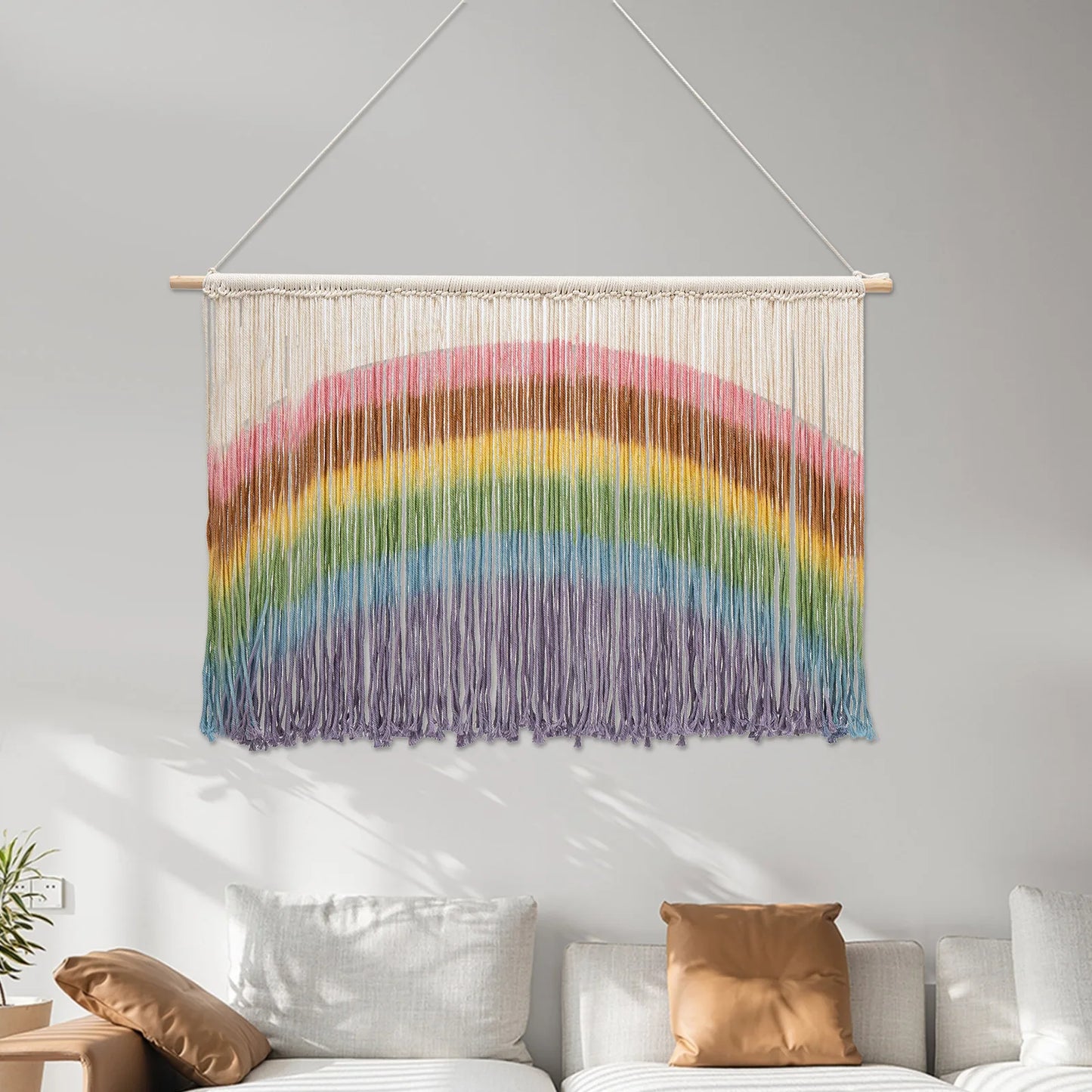 Colorful handmade weaving rainbow macrame wall hanging with wooden dowel and vibrant yarn strands for wall decor