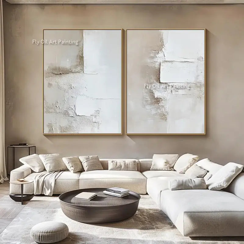 Two canvas wall white abstract oil paintings in beige and white tones with textured layered surfaces and gold frames