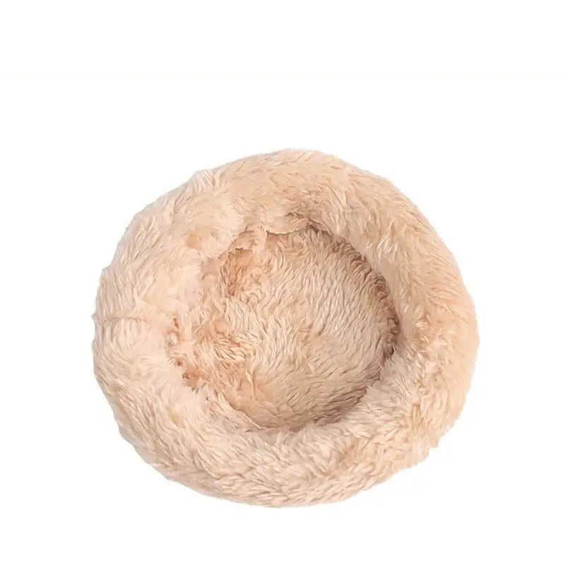 Beige plush circular pet bed with soft fluffy texture inside decorbites handwoven grass bird cage for small birds