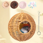 Woven wicker handwoven grass bird cage with heart-shaped entrance housing two colorful parrots by decorbites