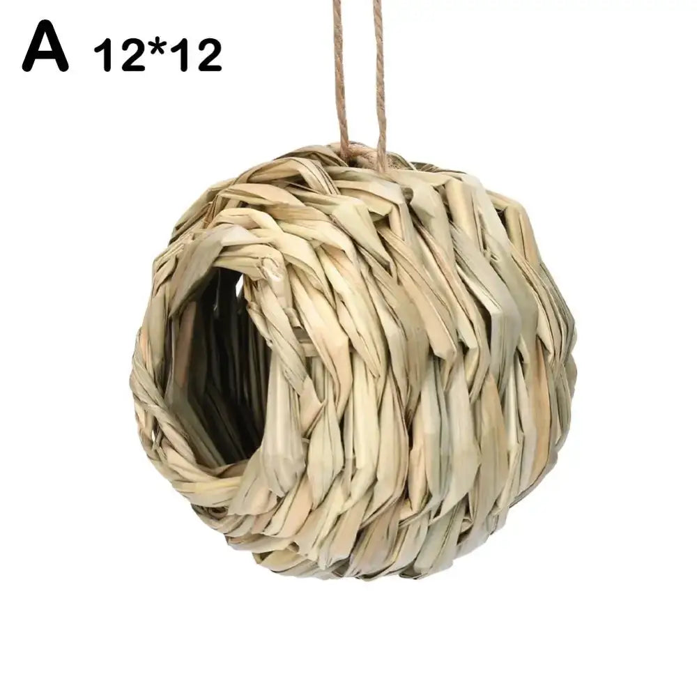 Beige handwoven straw bird nest hanging from natural fiber string for outdoor gardens by decorbites