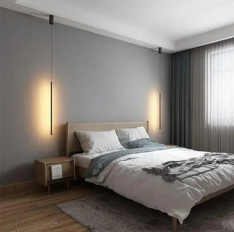 DecorBites™ hanging pendant lights feature slender black rods with warm vertical illumination for bedroom use