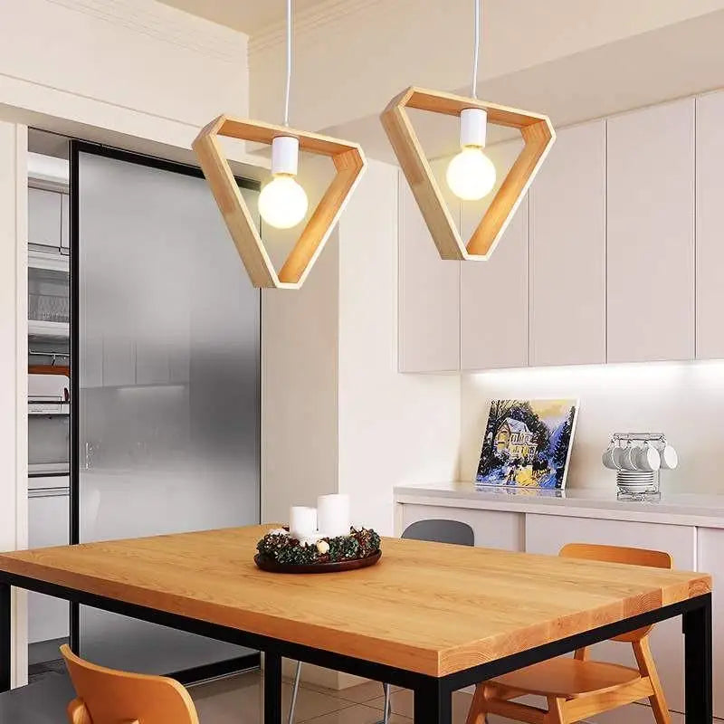 Decorbites™ hanging wooden lights feature two geometric triangular wooden lights with exposed bulbs over a dining table