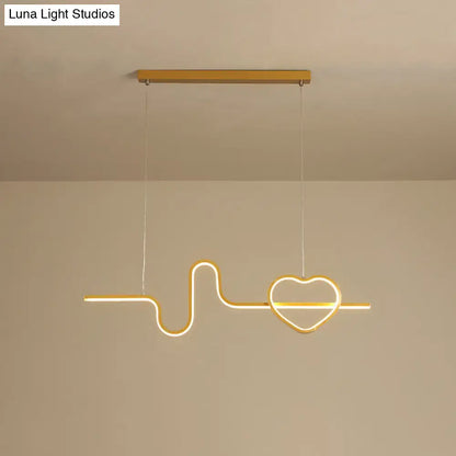 Gold-toned metal led pendant light shaped like an electrocardiogram line ending in a heart for dining room use