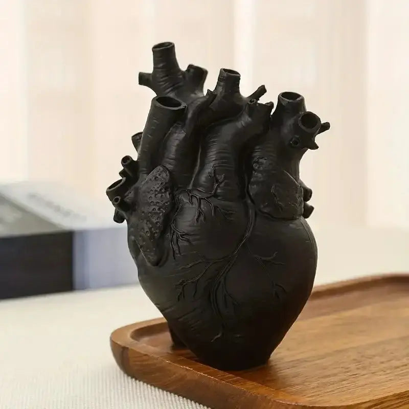 Black DecorBites™ heart shape resin vase with textured surface and multiple openings for decorative use