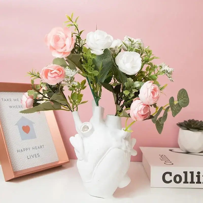 White ceramic decorbites™ heart shape resin vase with realistic anatomical details available in four colors