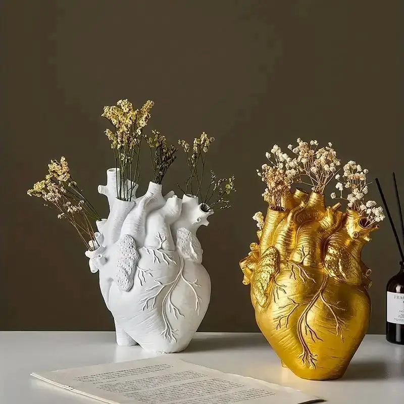 White and gold DecorBites™ heart shape resin vase with detailed veins holding dried flowers in shape resin design