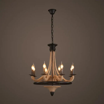 Black metal hanging lamp with cream hemp rope antique wrapped arms and five lit candle-style bulbs by DecorBites for restaurants