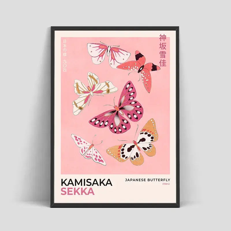A framed DecorBites™ Hokusai Japanese canvas art print with pink, white, and orange butterflies on soft pink background for home decor