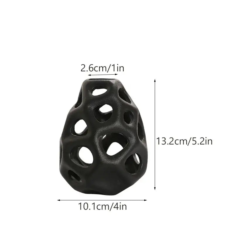 Black textured ceramic vase with geometric perforated design in nordic classical style by decorbites
