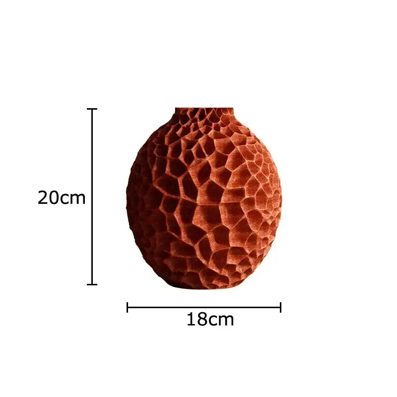 A terracotta ceramic decorbites honeycomb vase with textured surface ideal for office desk decor