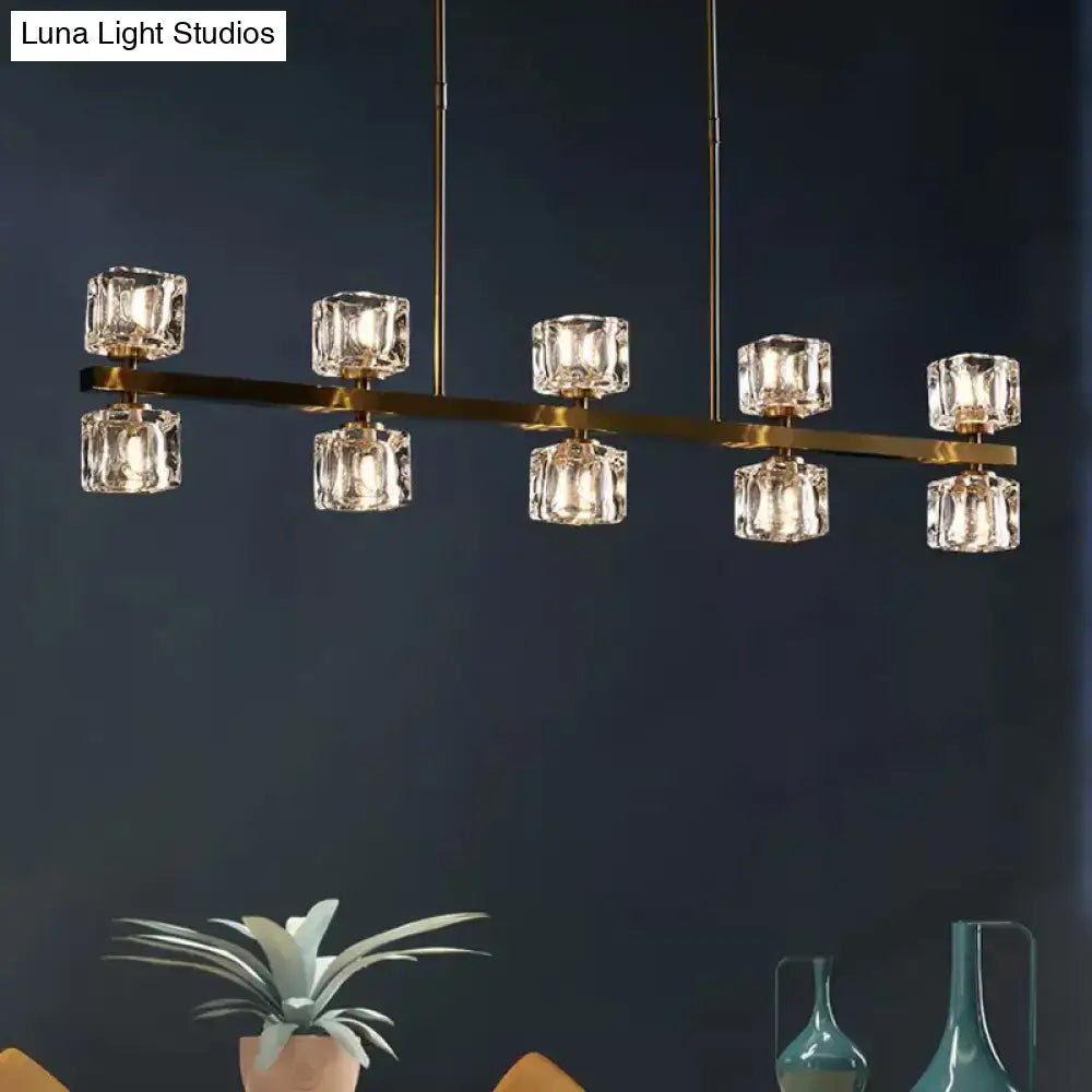Modern gold-toned DecorBites™ Ice Cube pendant light with faceted crystal cubes and universal bulb base for dining room use