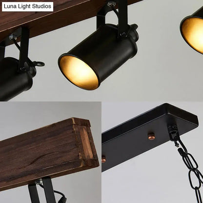 Decorbites industrial black metal light fixture with warm gold interiors mounted on rustic wood beam for island lighting