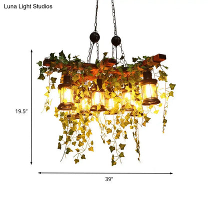 Rustic wooden chandelier featuring industrial black metal lantern island light with eight hanging lanterns and ivy vines
