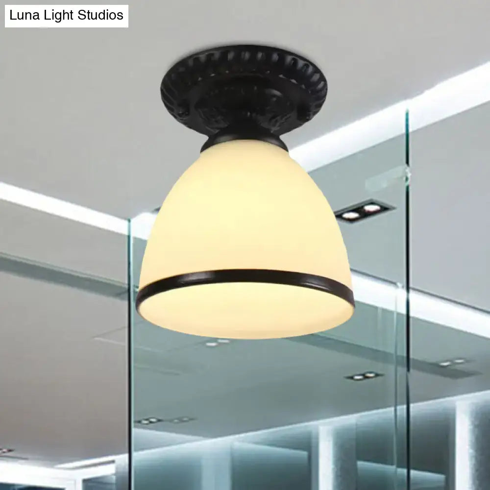 Black ornate semi flush ceiling light with milky glass dome flower shade and decorative metal trim for gallery use