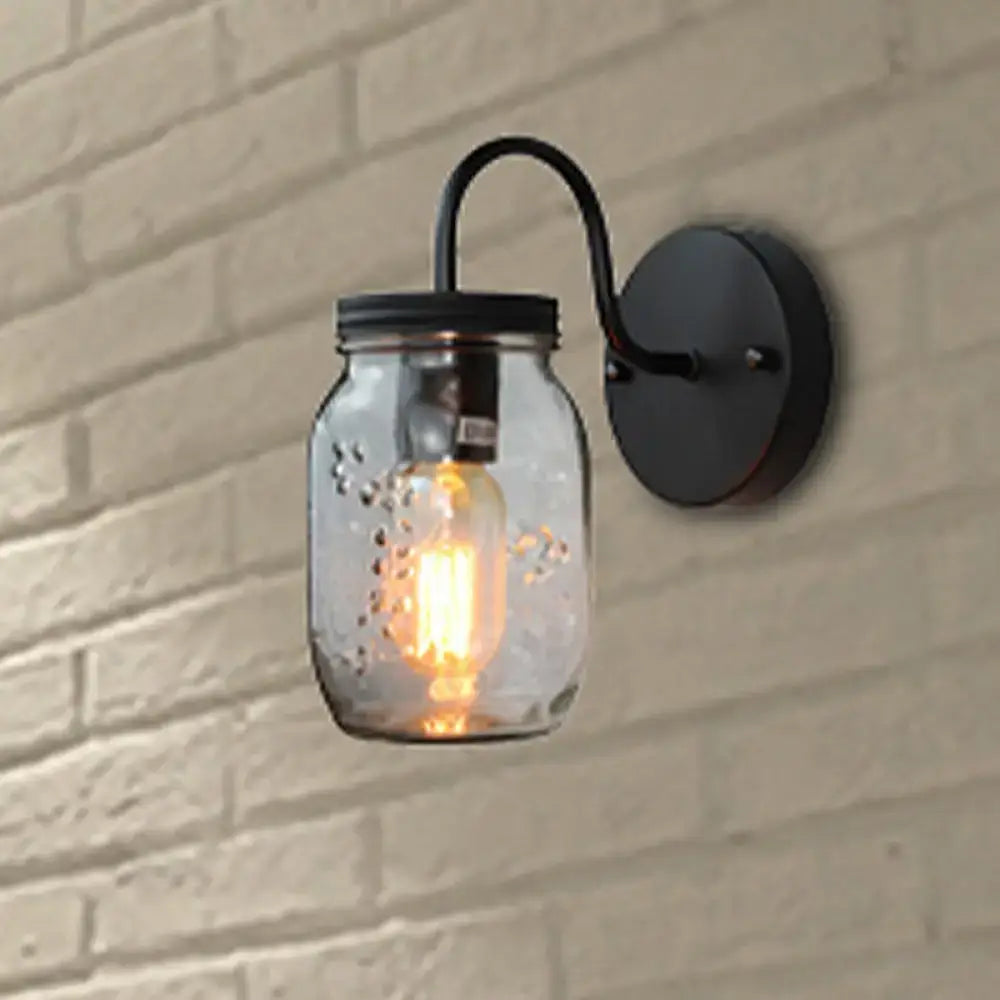 Industrial black jar shade clear glass wall lamp featuring a clear glass mason jar and exposed filament bulb