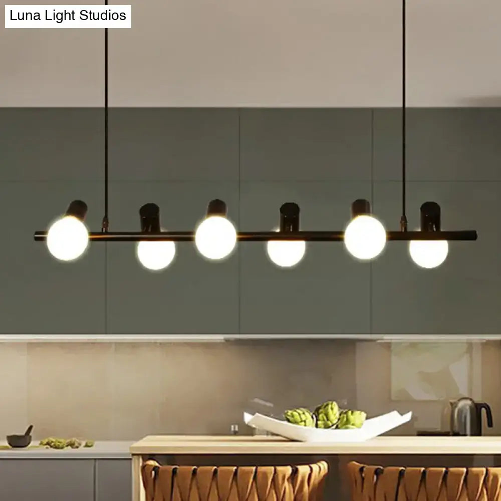 Modern black metal ceiling light with five glowing black naked bulb spheres for dining room island by DecorBites™