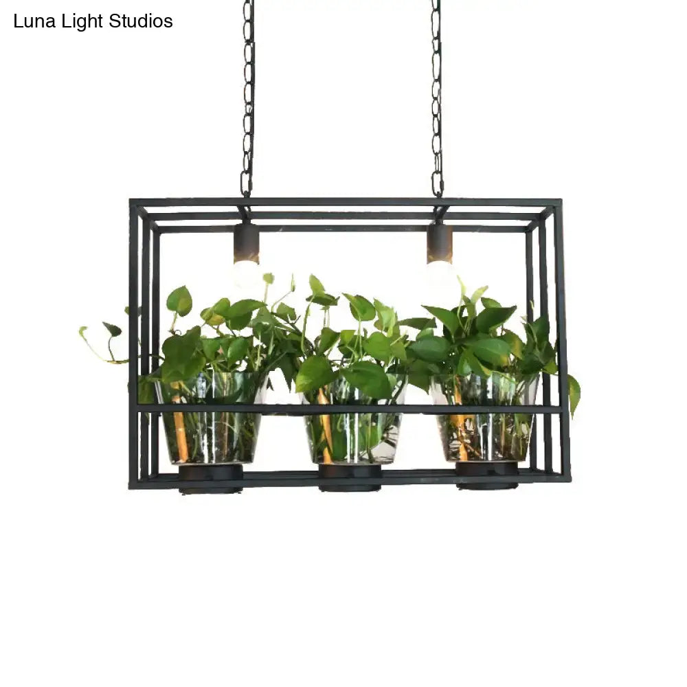 DecorBites™ industrial iron island lamp with black metal rectangular pendant and three glass plant pots with leafy plants