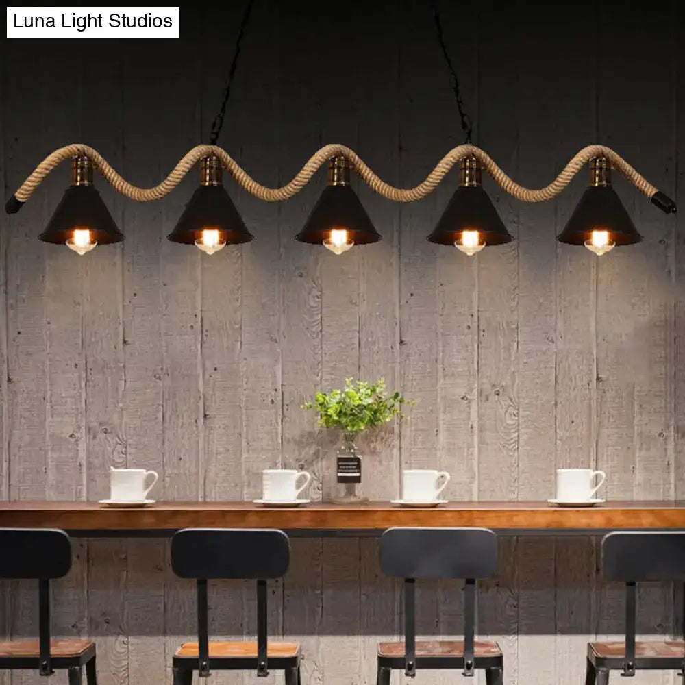 Industrial pendant lights with black finish metal cone shades and twisted rope suspension in matte black finish