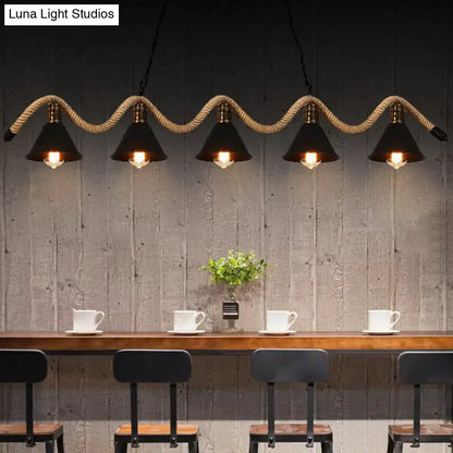 Industrial pendant lights with black finish metal cone shades and twisted rope suspension in matte black finish