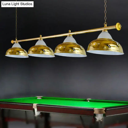 Gold-finished metal mirrored bowl suspended lighting fixture with four dome shades for billiard room decor