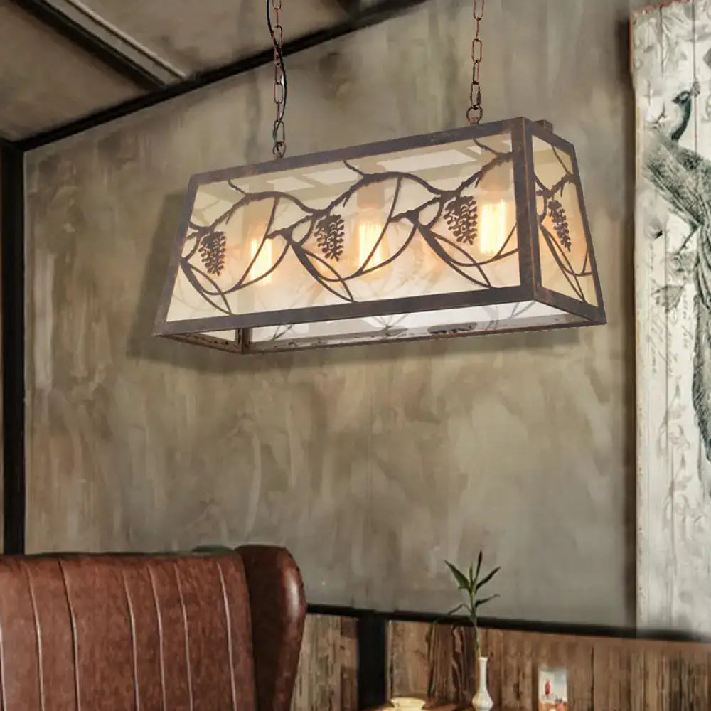 DecorBites™ industrial rectangular pendant light with bronze metal frame, frosted glass panels, and pinecone cutouts