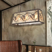 DecorBites™ industrial rectangular pendant light with bronze metal frame, frosted glass panels, and pinecone cutouts
