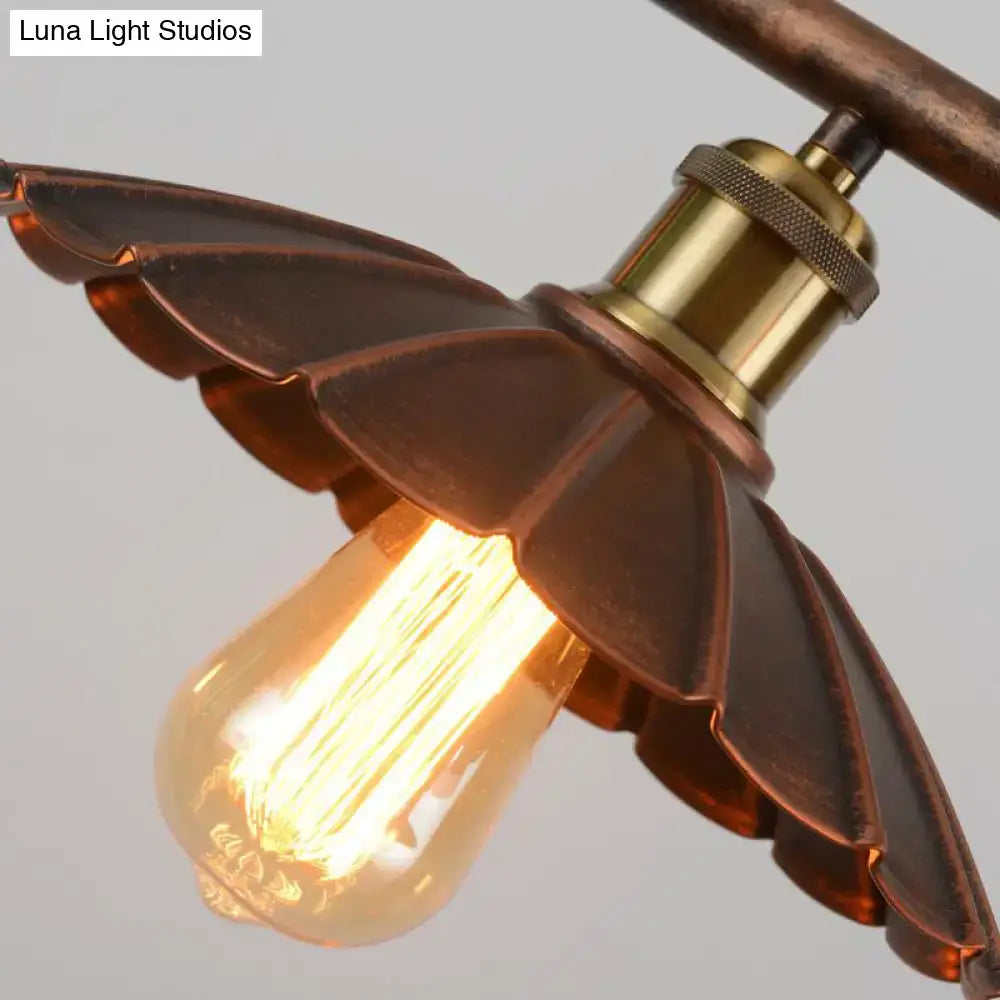 Antique brass leaf-shaped pendant light with glowing edison bulb in DecorBites rust scalloped suspended lighting fixture