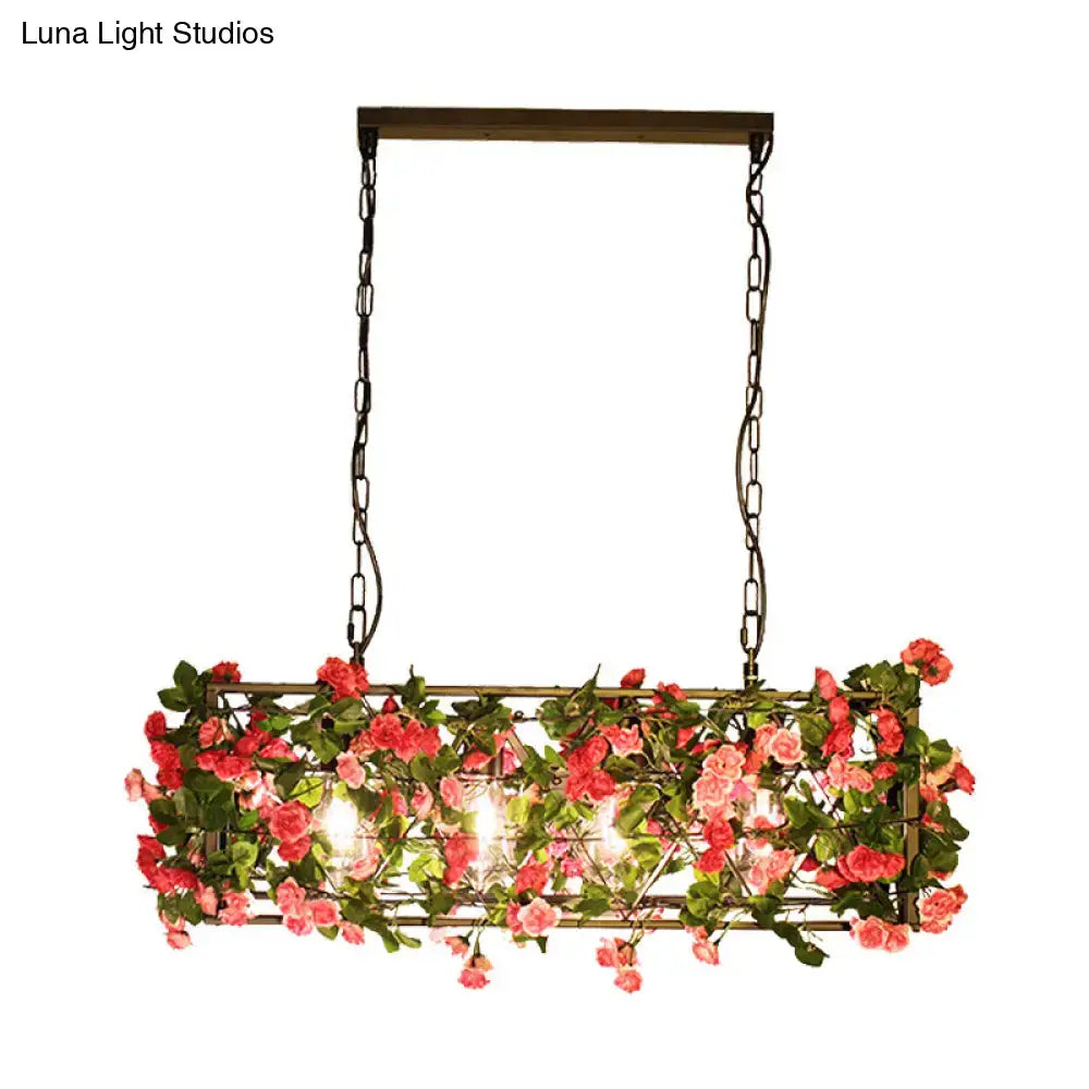 Rectangular pendant light with dark metal construction, hanging chains, pink artificial roses, ideal for bedroom fixture height