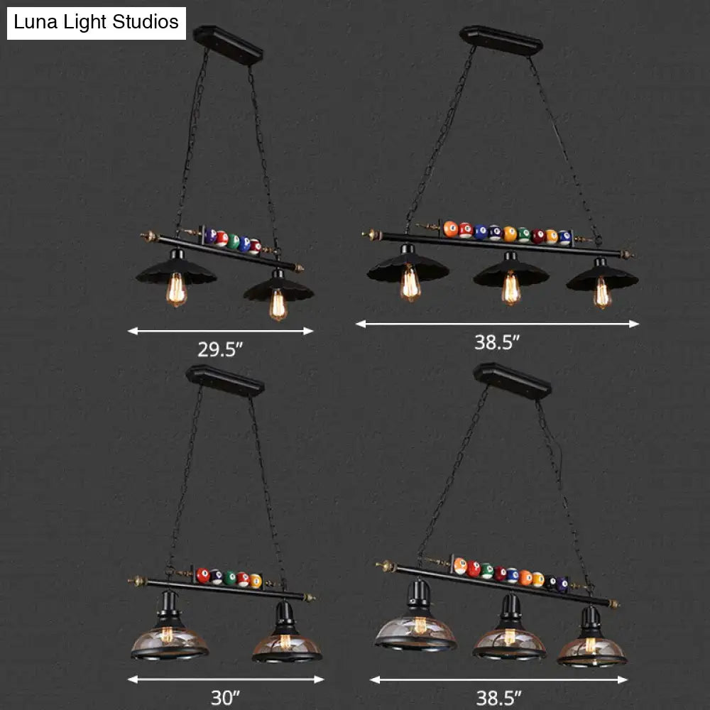 Industrial style black metal billiard light pendant with vintage edison bulbs and chain cord length above colorful balls