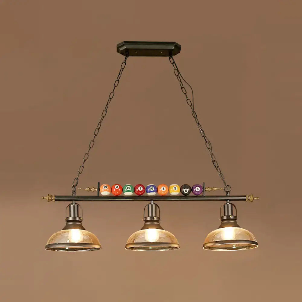 DecorBites™ industrial style black metal billiard light pendant with chain cord length brass accents and amber glass shades