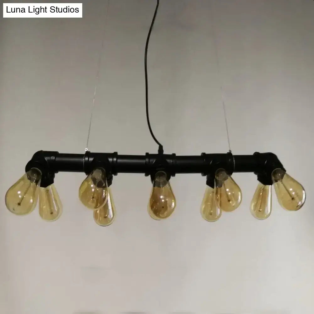 Industrial style ceiling light fixture featuring black metal piping and five amber glass filament bulbs for dining room use